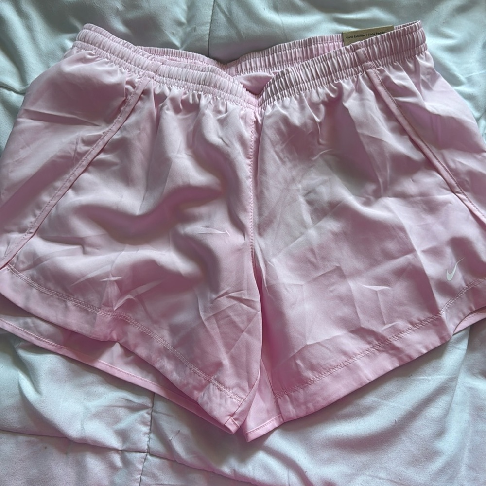 Nike Dri-fit running shorts
Color: pink 
New with tags
Size L kids